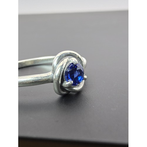 179 - An as new genuine Pandora 925 silver ring inset with a blue crystal stone, the ring is marked S925 A... 