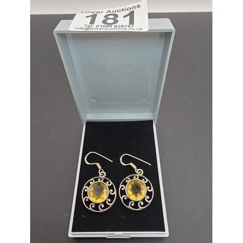 181 - A pair of attractive vintage 925 silver drop earrings having a pierced design, inset with large face... 