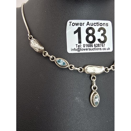 183 - A good quality vintage 925 silver necklace which is inset with 3 faceted aqua marine stones and inse... 