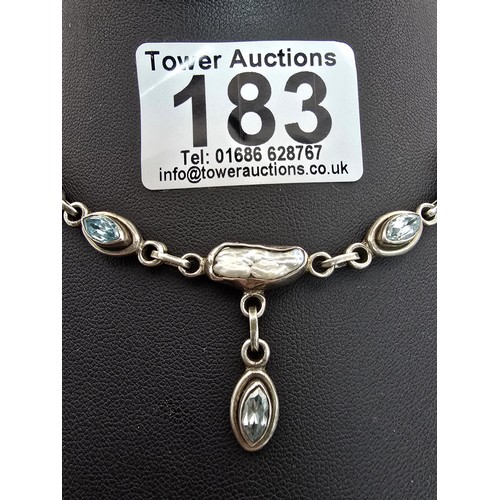 183 - A good quality vintage 925 silver necklace which is inset with 3 faceted aqua marine stones and inse... 