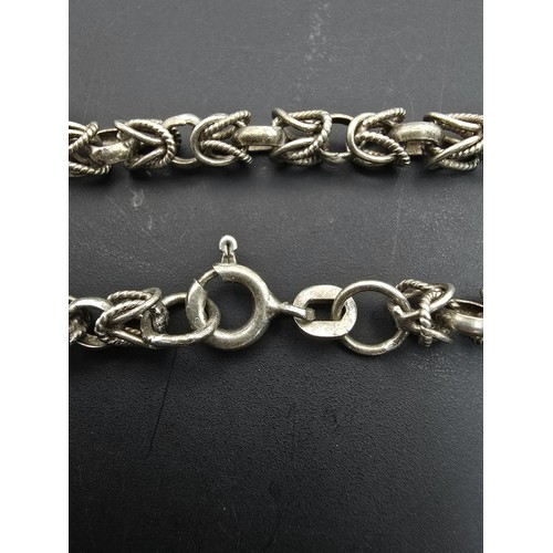 185 - A pretty 925 silver bracelet having an unusual multi link design, in good clean condition and boxed.... 