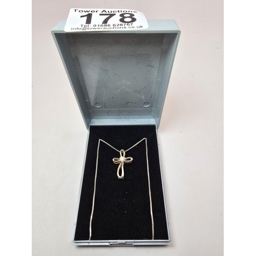 209 - A 925 silver stylized Cross pendant inset with a  sparkly CZ crystal stone on an 18