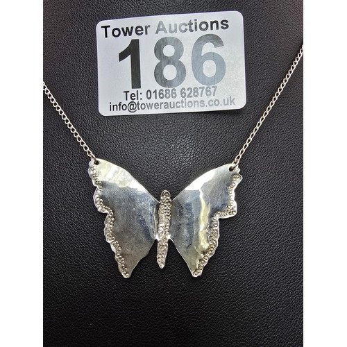 186 - A pretty 925 silver necklace featuring a large butterfly pendant, in good clean condition having a t... 