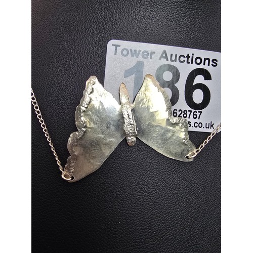 186 - A pretty 925 silver necklace featuring a large butterfly pendant, in good clean condition having a t... 