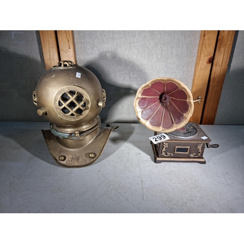 299 - Good quality cast iron decorative gramophone along with a brass decorative small divers helmet, helm... 