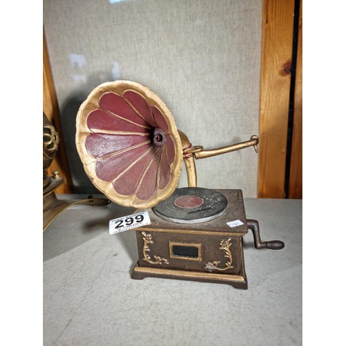 299 - Good quality cast iron decorative gramophone along with a brass decorative small divers helmet, helm... 