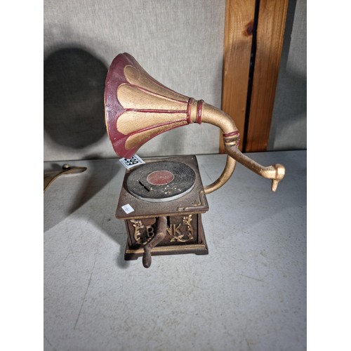 299 - Good quality cast iron decorative gramophone along with a brass decorative small divers helmet, helm... 