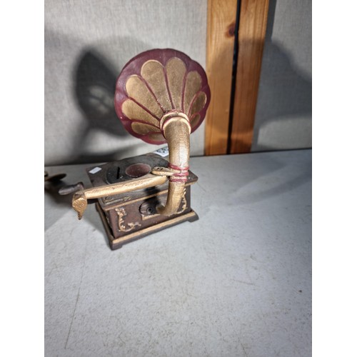 299 - Good quality cast iron decorative gramophone along with a brass decorative small divers helmet, helm... 