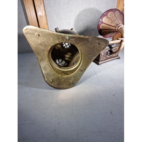 299 - Good quality cast iron decorative gramophone along with a brass decorative small divers helmet, helm... 