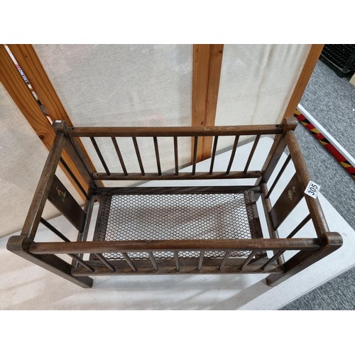 305 - Small child's antique wooden crib with metal mesh base, made in 1900 by Wale & Sons of Birmingham, d... 