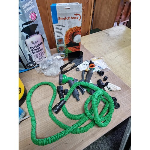 311 - Quantity of hose and sprayers inc an 8 litre portable manual power washer, 2x boxed stretch hoses in... 