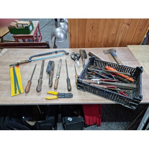 312 - Crate containing a quantity of assorted tools inc wire brushes, an axe, files, wire cutter pliers, a... 