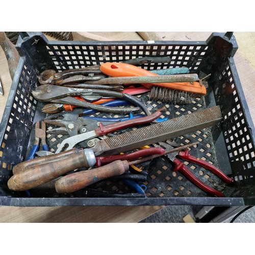 312 - Crate containing a quantity of assorted tools inc wire brushes, an axe, files, wire cutter pliers, a... 