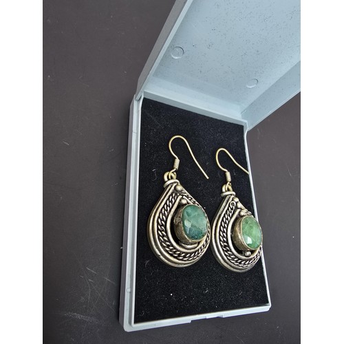 190 - Pair of unusual middle eastern Silver plated drop earrings inset with large faceted genuine green sa... 