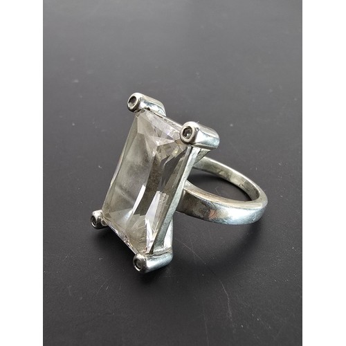 192 - Impressive Hallmarked 925 Silver dress ring inset with a large faceted crystal glass stone in clean ... 