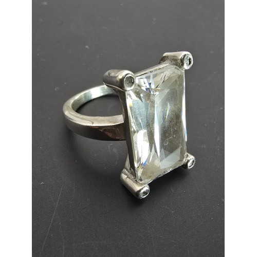 192 - Impressive Hallmarked 925 Silver dress ring inset with a large faceted crystal glass stone in clean ... 