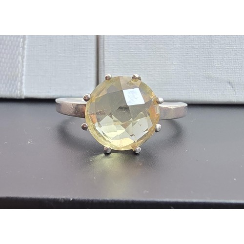 202 - A good quality 925 silver statement ring inset with a large natural citrine domed faceted gemstone, ... 