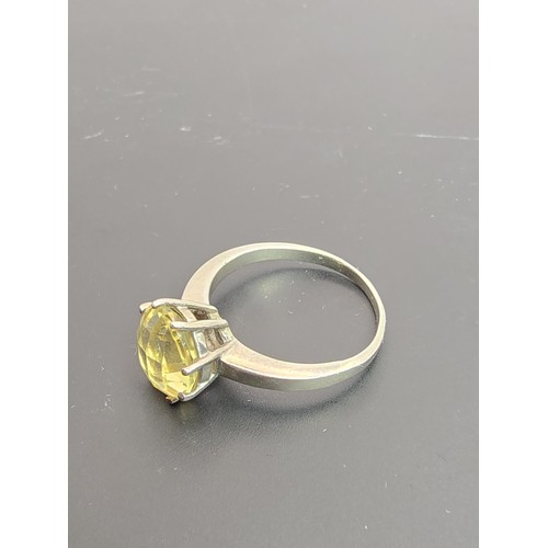 202 - A good quality 925 silver statement ring inset with a large natural citrine domed faceted gemstone, ... 