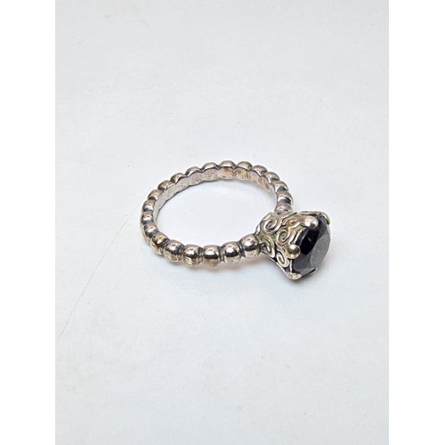 203 - A genuine Pandora 925 silver ring with an ornate design inset with a large faceted black tourmaline ... 