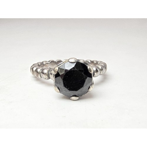 203 - A genuine Pandora 925 silver ring with an ornate design inset with a large faceted black tourmaline ... 