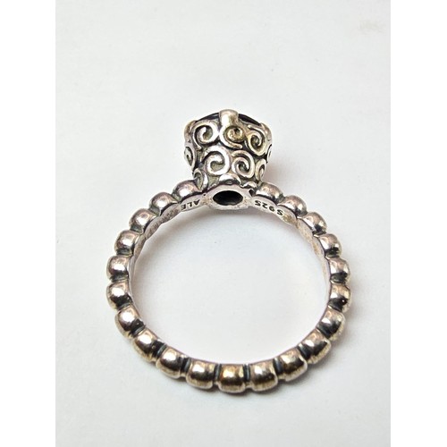 203 - A genuine Pandora 925 silver ring with an ornate design inset with a large faceted black tourmaline ... 