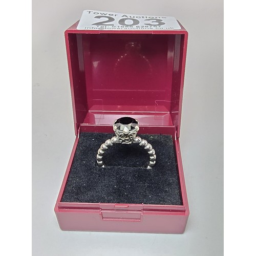 203 - A genuine Pandora 925 silver ring with an ornate design inset with a large faceted black tourmaline ... 