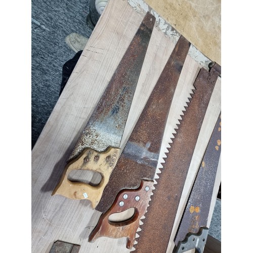 338 - Collection of carpenters and wood saws including a good quality two man wood saw, Spear and Jackson ... 