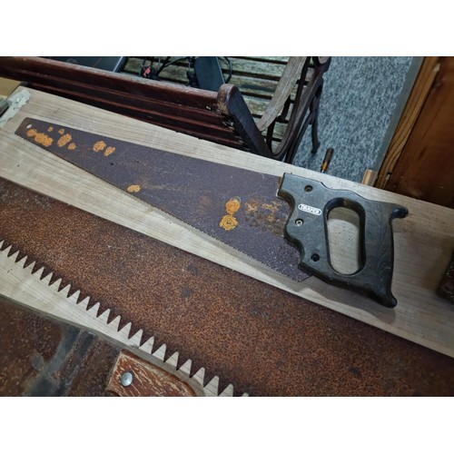 338 - Collection of carpenters and wood saws including a good quality two man wood saw, Spear and Jackson ... 