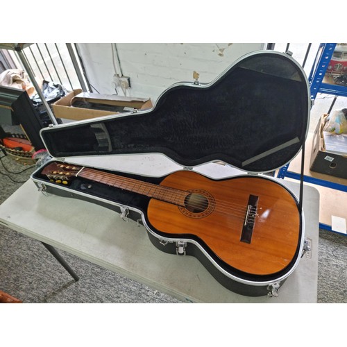 368 - A Full size, nylon strung classical guitar, in playable condition with hard case. Hard case is missi... 