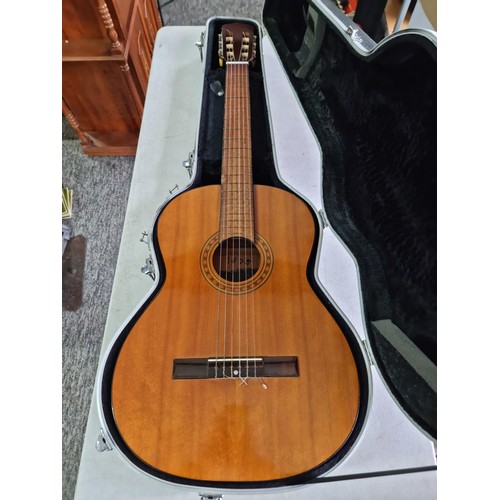 368 - A Full size, nylon strung classical guitar, in playable condition with hard case. Hard case is missi... 