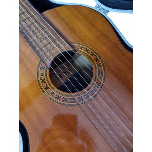 368 - A Full size, nylon strung classical guitar, in playable condition with hard case. Hard case is missi... 