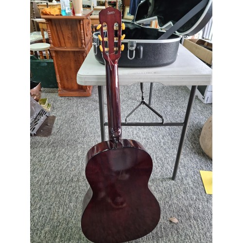 368 - A Full size, nylon strung classical guitar, in playable condition with hard case. Hard case is missi... 