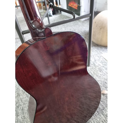 368 - A Full size, nylon strung classical guitar, in playable condition with hard case. Hard case is missi... 