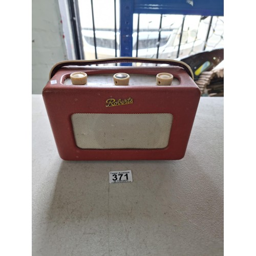 371 - A small portable Roberts transistor radio model R-200, battery operated with built in aerial, along ... 