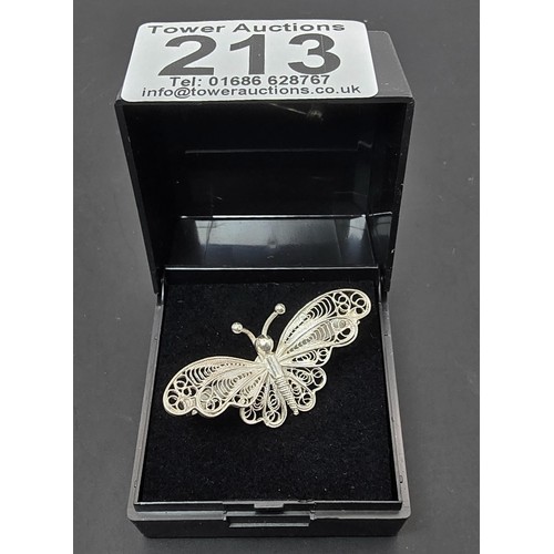 213 - A pretty 925 silver butterfly brooch having a filigree design, in as new condition and boxed. Has a ... 