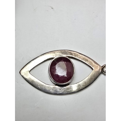 216 - A good large 925 silver pendant inset with a large natural faceted ruby stone, the pendants in good ... 