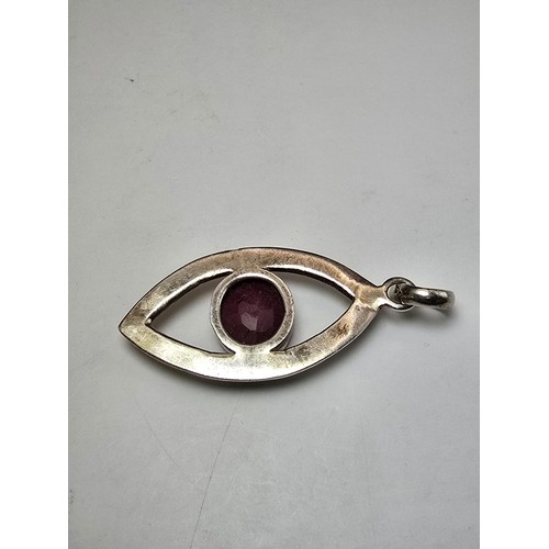 216 - A good large 925 silver pendant inset with a large natural faceted ruby stone, the pendants in good ... 