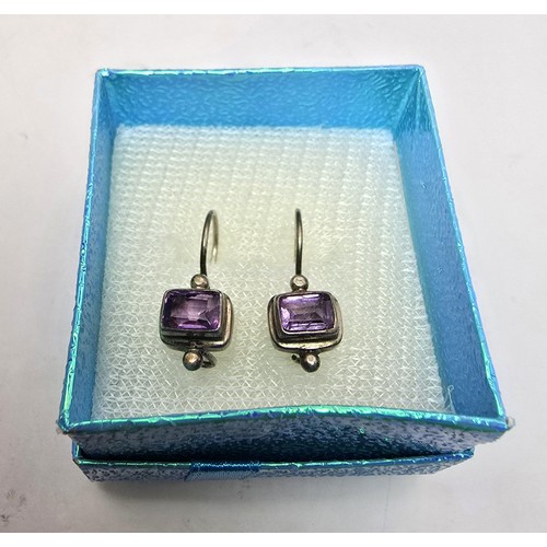 218 - 2 pairs of pretty 925 silver earrings to include a pair inset with faceted baguette cut amethyst sto... 