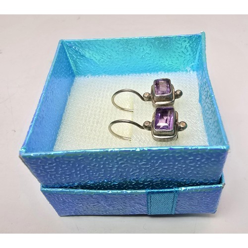 218 - 2 pairs of pretty 925 silver earrings to include a pair inset with faceted baguette cut amethyst sto... 