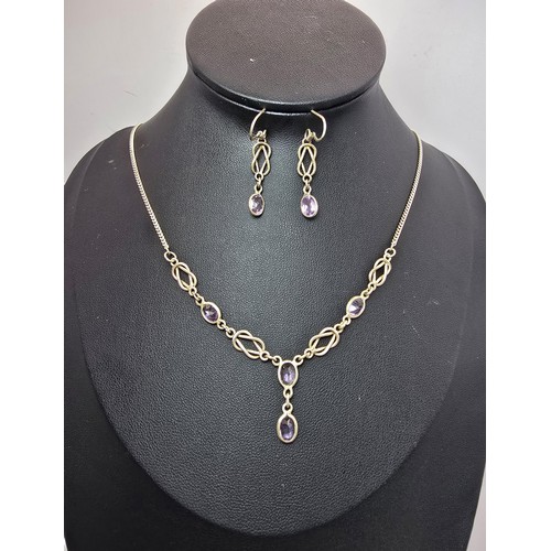 219 - A pretty hand made 925 silver and amethyst matching jewellery set featuring a pretty necklace inset ... 