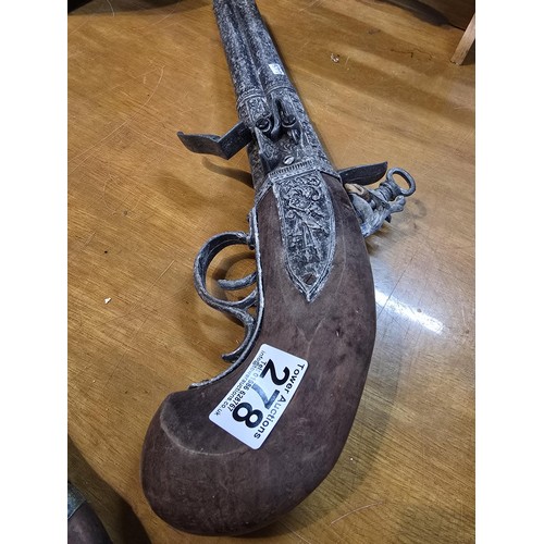 278 - 2x replica 18th century flintlock pistols each having a different design, made out of solid wood wit... 