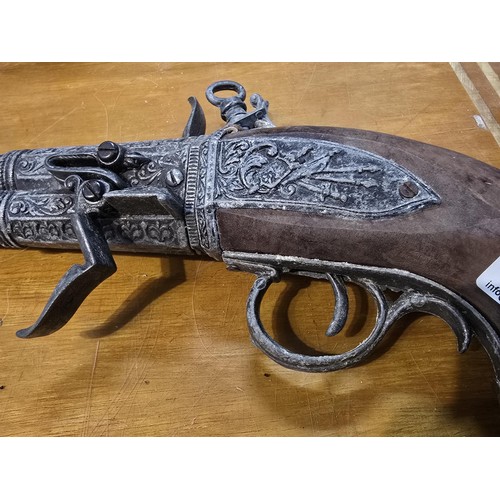 278 - 2x replica 18th century flintlock pistols each having a different design, made out of solid wood wit... 