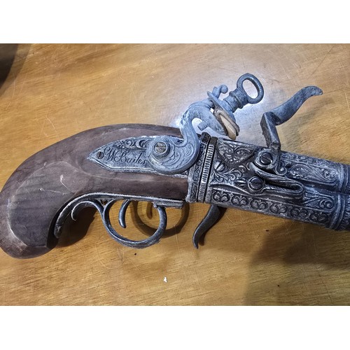 278 - 2x replica 18th century flintlock pistols each having a different design, made out of solid wood wit... 