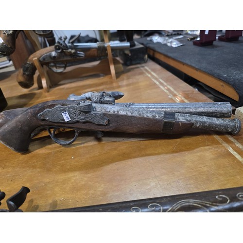 278 - 2x replica 18th century flintlock pistols each having a different design, made out of solid wood wit... 