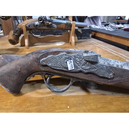 278 - 2x replica 18th century flintlock pistols each having a different design, made out of solid wood wit... 