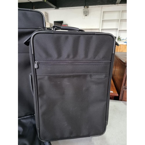 389 - Pair of very good quality Briggs & Riley suitcases in very good condition, along with a suit a suit ... 