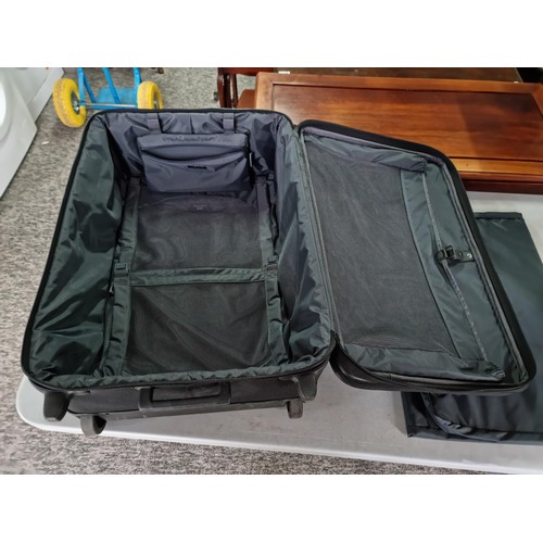 389 - Pair of very good quality Briggs & Riley suitcases in very good condition, along with a suit a suit ... 