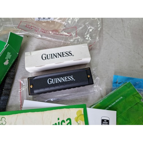 383 - Large quantity of Guinness memorabilia from a pub, inc inflatable cup holders, ashtrays, water jugs ... 