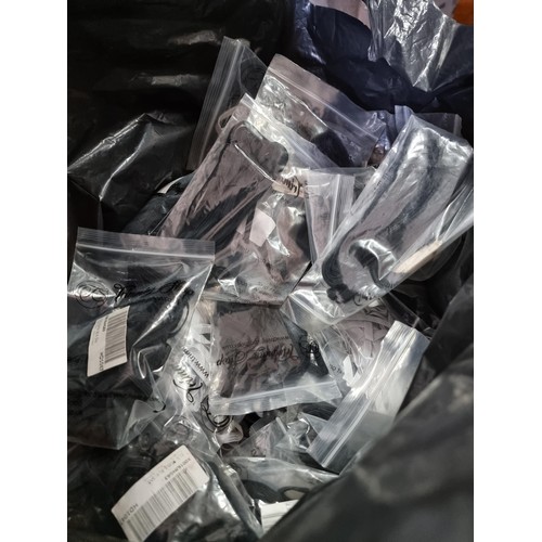 384 - Bag containing a very large quantity of elastic in black and white all in bags in 5m and 10m lengths