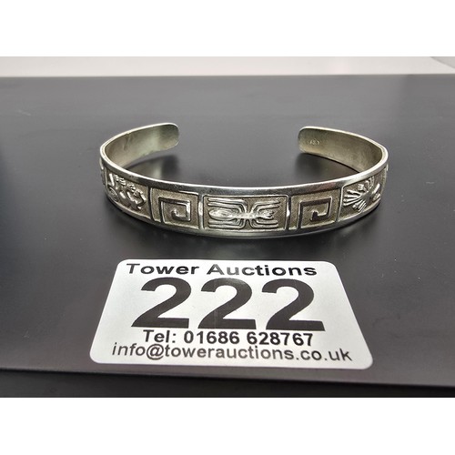 222 - A chunky 925 silver torque bangle having an Aztec South American design, is in good clean condition ... 